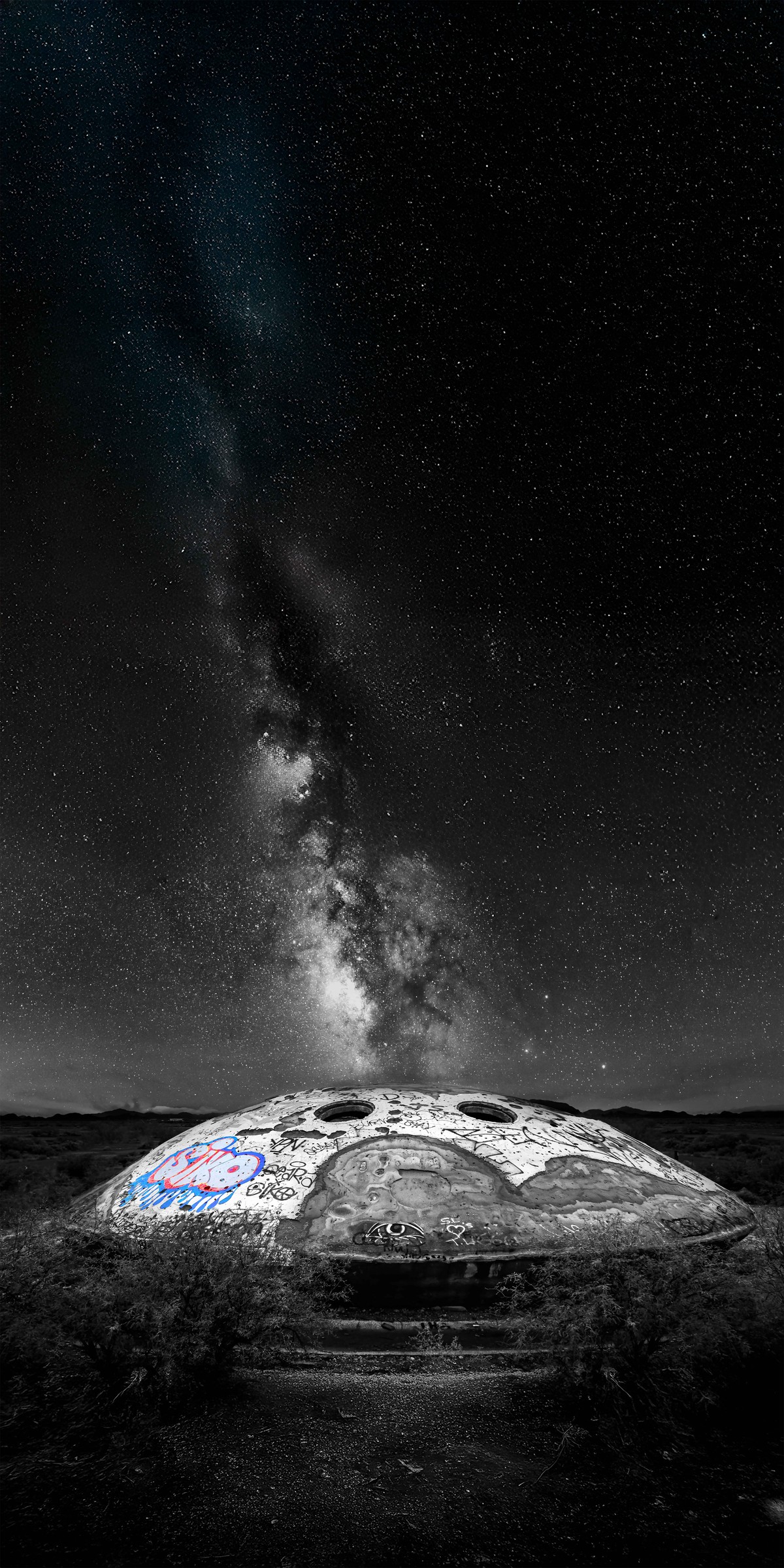 A solitary dome beneath a tall column of Milky Way stars